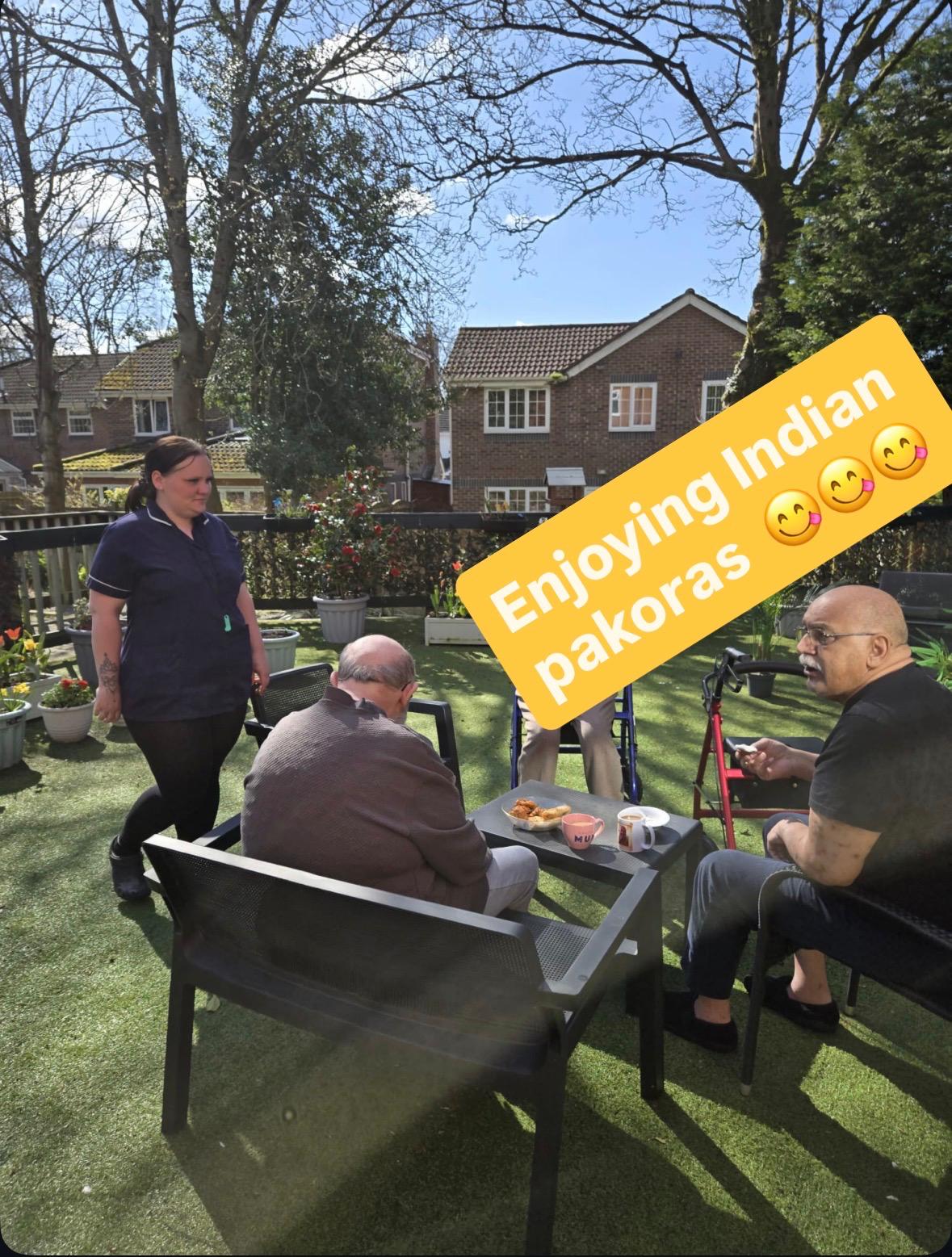 Residents enjoying Indian snacks